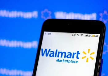 Phone loading the Walmart Marketplace app.