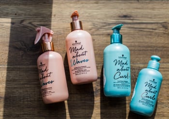 Four Mad about Waves bottles of products.