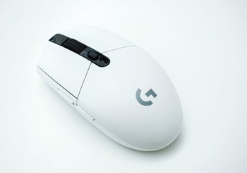 White wireless mouse on a white background.