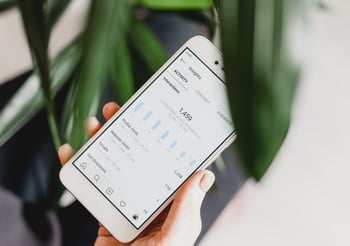 Person looking at Instagram insights on a smartphone.