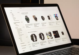 eBay store showing watches on a laptop computer.